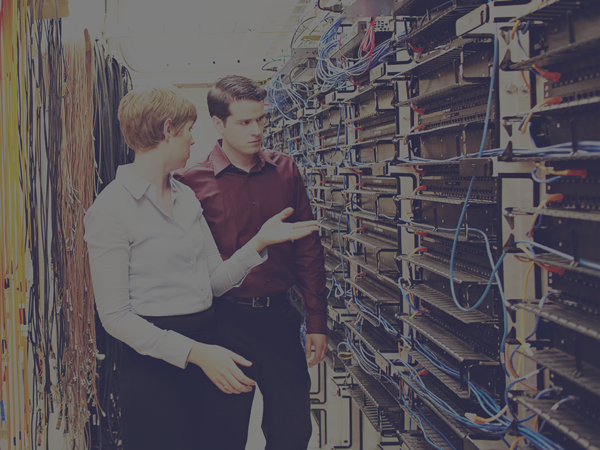 Two people in a data center